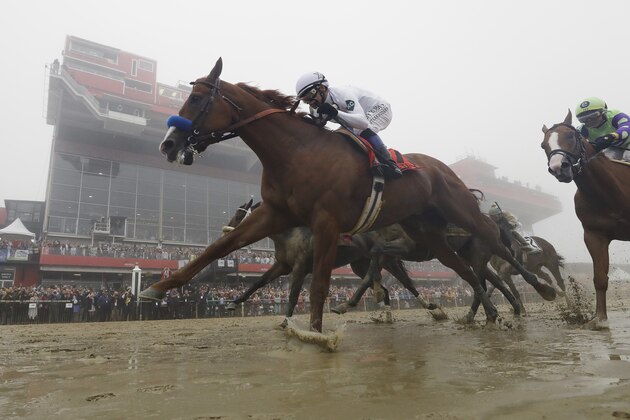 Justify with Mike Smith atop wins the the 143rd Preakness Stakes horse race at Pimlico race course, Saturday, May 19, 2018, in Baltimore. (AP Photo/Patrick Semansky)