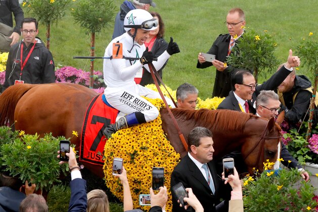 BALTIMORE, MD - MAY 19:  Jockey Mike Smith and racing horse Justify enter the winners circle at the 143rd Preakness Stakes on May 19, 2018 in Baltimore, Maryland.  (Photo by Paul Morigi/Getty Images for The Stronach Group)
