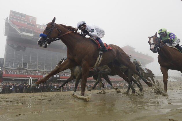 Justify with Mike Smith atop wins the the 143rd Preakness Stakes horse race at Pimlico race course, Saturday, May 19, 2018, in Baltimore. (AP Photo/Patrick Semansky)