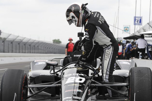 Ed Carpenter climbs into his car during a practice session for the IndyCar Indianapolis 500 auto race at Indianapolis Motor Speedway in Indianapolis, Wednesday, May 16, 2018. (AP Photo/Darron Cummings)
