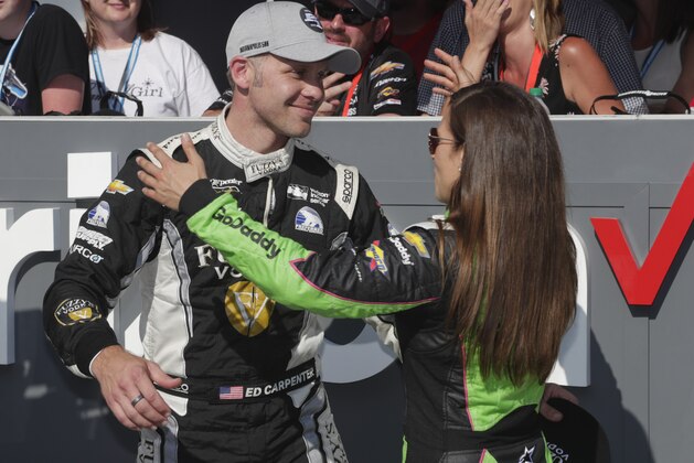 Ed Carpenter is hugged by Danica Patrick after winning the pole during qualifications for the IndyCar Indianapolis 500 auto race at Indianapolis Motor Speedway, in Indianapolis Sunday, May 20, 2018. (AP Photo/Michael Conroy)