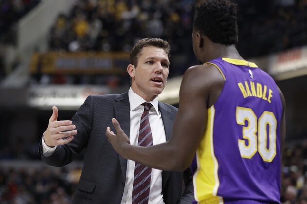 Los Angeles Lakers head coach Luke Walton, left, talks with Julius Randle during the second half of an NBA basketball game against the Indiana Pacers, Monday, March 19, 2018, in Indianapolis. (AP Photo/Darron Cummings)