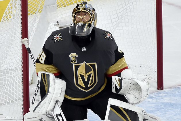 Vegas Golden Knights goalie Marc-Andre Fleury eyes the puck as he defends the goal against the Winnipeg Jets during the second period of Game 3 of the NHL Western Conference finals hockey playoff series Wednesday, May 16, 2018, in Las Vegas. (AP Photo/David Becker)