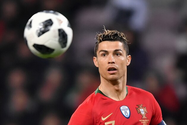 Portugal's forward Cristiano Ronaldo eyes the ball during the international friendly football match between Portugal and Netherlands at Stade de Geneve stadium in Geneva on March 26, 2018. / AFP PHOTO / Fabrice COFFRINI        (Photo credit should read FABRICE COFFRINI/AFP/Getty Images)