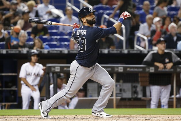 FILE - In this May 10, 2018, file photo, Atlanta Braves' Jose Bautista bats during the fourth inning of a baseball game against the Miami Marlins in Miami. The Braves have released Bautista a month after picking up the veteran slugger and will make Johan Camargo their starting third baseman. (AP Photo/Wilfredo Lee, File)