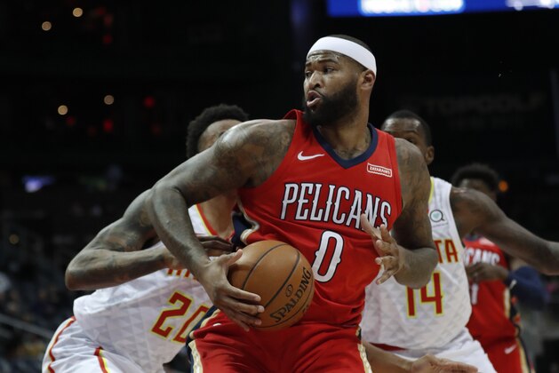 New Orleans Pelicans center DeMarcus Cousins (0) works against Atlanta Hawks forward John Collins (20) during the second half of an NBA basketball game Wednesday, Jan. 17, 2018, in Atlanta. The Hawks won 94-93. (AP Photo/John Bazemore)