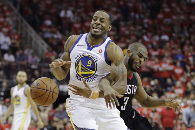Golden State Warriors forward Andre Iguodala (9) is fouled by Houston Rockets guard Chris Paul (3) during the second half of Game 1 of the NBA basketball Western Conference Finals, Monday, May 14, 2018, in Houston. (AP Photo/David J. Phillip)