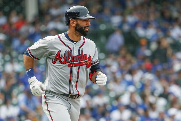 Atlanta Braves' Jose Bautista watches his three-run home run off Chicago Cubs' Jose Quintana during the fifth inning of a baseball game, Monday, May 14, 2018, in Chicago. Braves' Nick Markakis and Tyler Flowers scored on the play. (AP Photo/Kamil Krzaczynski)