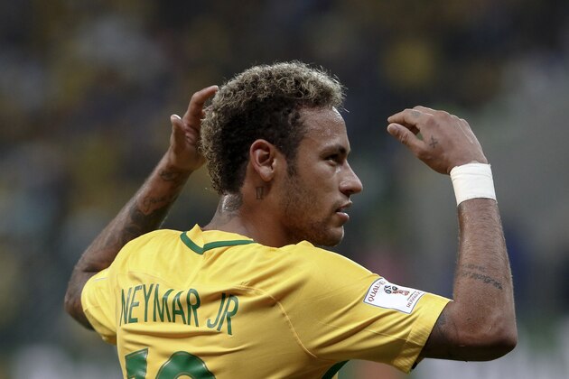 Brazil's Neymar celebrates during the 2018 World Cup football qualifier match against Chile in Sao Paulo, Brazil, on October 10, 2017. / AFP PHOTO / Miguel SCHINCARIOL        (Photo credit should read MIGUEL SCHINCARIOL/AFP/Getty Images)
