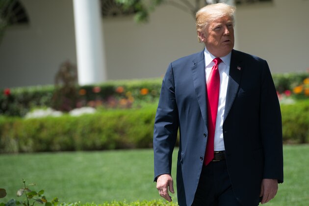 US President Donald Trump walks through the Rose Garden as he arrives to honor NASCAR Cup Series champion Martin Truex Jr. and his team, during a ceremony on the South Lawn of the White House in Washington, DC, May 21, 2018. (Photo by SAUL LOEB / AFP)        (Photo credit should read SAUL LOEB/AFP/Getty Images)