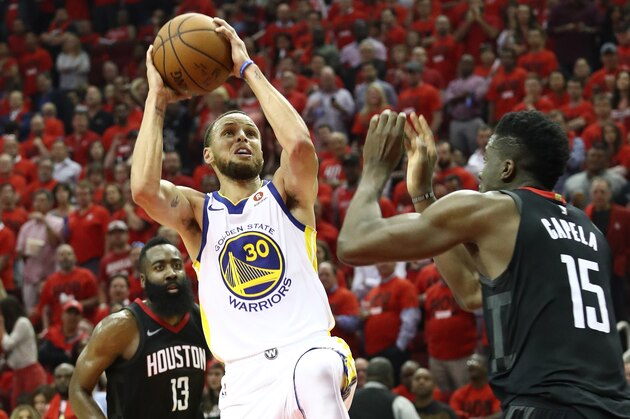 HOUSTON, TX - MAY 16:  Stephen Curry #30 of the Golden State Warriors shoots against Clint Capela #15 of the Houston Rockets in the third quarter of Game Two of the Western Conference Finals of the 2018 NBA Playoffs at Toyota Center on May 16, 2018 in Houston, Texas.  (Photo by Ronald Martinez/Getty Images)