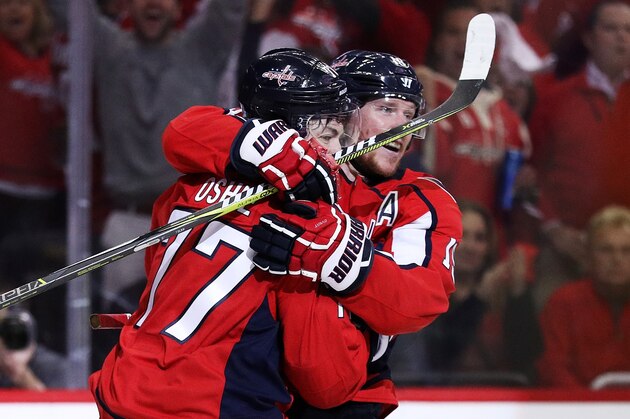 WASHINGTON, DC - MAY 21:  T.J. Oshie #77 of the Washington Capitals celebrates his second period goal with teammate Nicklas Backstrom #19 against the Tampa Bay Lightning in Game Six of the Eastern Conference Finals during the 2018 NHL Stanley Cup Playoffs at Capital One Arena on May 21, 2018 in Washington, DC.  (Photo by Patrick Smith/Getty Images)