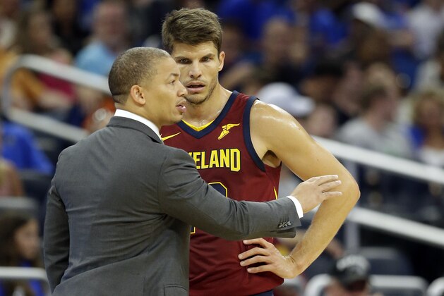 Cleveland Cavaliers head coach Tyronn Lue, left, talks with Kyle Korver during the second half of an NBA preseason basketball game against the Orlando Magic, Friday, Oct. 13, 2017, in Orlando, Fla. Cleveland won 113-106. (AP Photo/John Raoux)