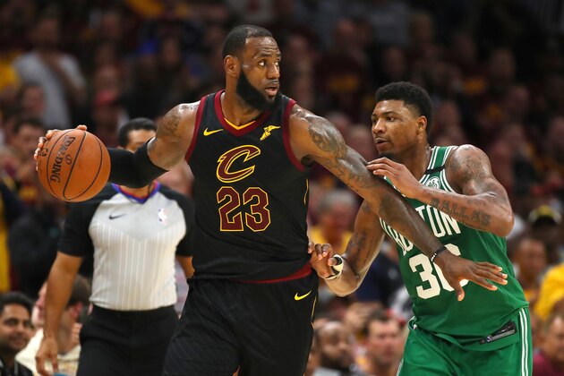 CLEVELAND, OH - MAY 21:  LeBron James #23 of the Cleveland Cavaliers handles the ball against Marcus Smart #36 of the Boston Celtics in the fourth quarter during Game Four of the 2018 NBA Eastern Conference Finals at Quicken Loans Arena on May 21, 2018 in Cleveland, Ohio. NOTE TO USER: User expressly acknowledges and agrees that, by downloading and or using this photograph, User is consenting to the terms and conditions of the Getty Images License Agreement.  (Photo by Gregory Shamus/Getty Images)