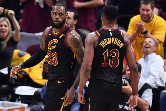 CLEVELAND, OH - MAY 21: LeBron James #23 of the Cleveland Cavaliers reacts after a basket with Tristan Thompson #13 in the first quarter against the Boston Celtics during Game Four of the 2018 NBA Eastern Conference Finals at Quicken Loans Arena on May 21, 2018 in Cleveland, Ohio. NOTE TO USER: User expressly acknowledges and agrees that, by downloading and or using this photograph, User is consenting to the terms and conditions of the Getty Images License Agreement.  (Photo by Jamie Sabau/Getty Images)