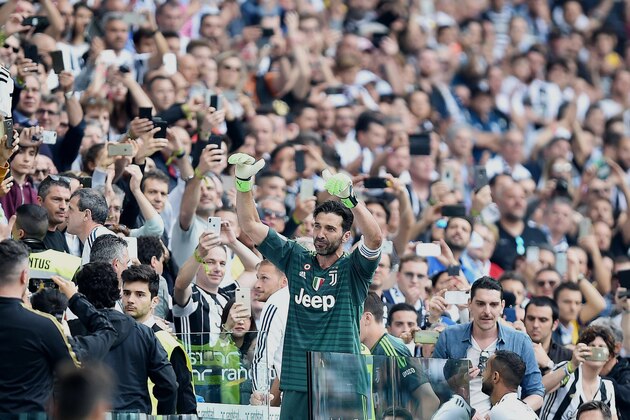 Juventus goalie Gianluigi Buffon greets supporters at the Allianz Stadium in Turin, Italy, Saturday, May 19, 2018. Juventus beat already relegated Hellas Verona 2-1 in the final round of the season on Saturday but the result mattered little as the club bid an emotional farewell to Buffon, while it also received a record-extending seventh successive Serie A trophy. (Alessandro Di Marco/ANSA via AP)