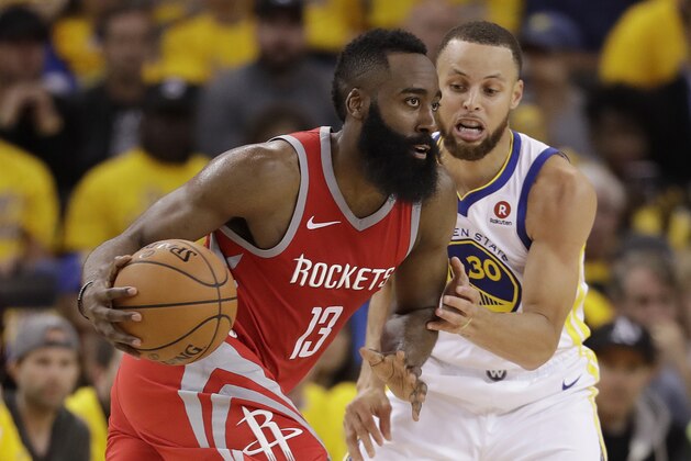 Houston Rockets guard James Harden (13) is guarded by Golden State Warriors guard Stephen Curry (30) during Game 3 of the NBA basketball Western Conference Finals in Oakland, Calif., Sunday, May 20, 2018. (AP Photo/Marcio Jose Sanchez)
