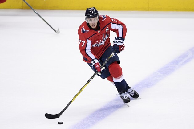 Washington Capitals right wing T.J. Oshie (77) skates with the puck during the third period of Game 3 of the NHL Eastern Conference finals hockey playoff series against the Tampa Bay Lightning, Tuesday, May 15, 2018 in Washington. The Lightning won 4-2. (AP Photo/Nick Wass)