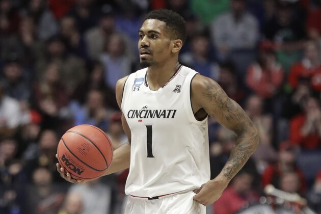 Cincinnati guard Jacob Evans (1) dribbles the ball during the first half of a second-round game against the Nevada in the NCAA college basketball tournament in Nashville, Tenn., Sunday, March 18, 2018. (AP Photo/Mark Humphrey)