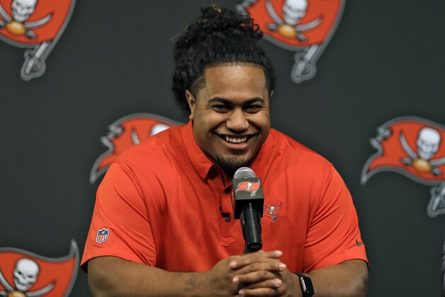Tampa Bay Buccaneers NFL football first-round draft pick Vita Vea smiles as he meets the media during a news conference Friday, April 27, 2018, in Tampa, Fla. Vea, a defensive lineman, played his college football at Washington. (AP Photo/Chris O'Meara)