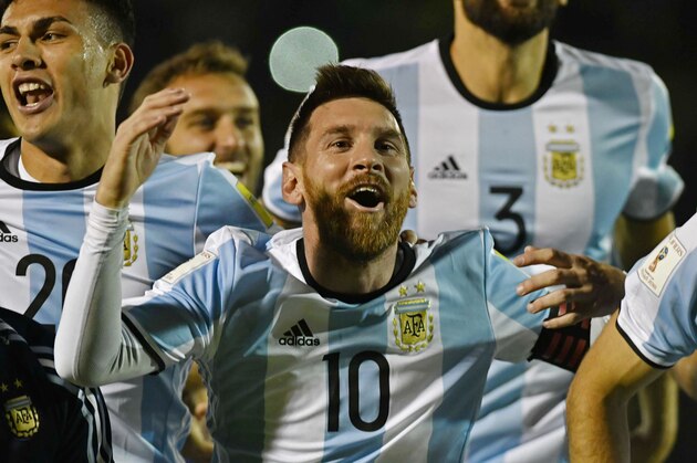 Argentina's Lionel Messi (C) celebrates after defeating Ecuador and qualifying to the 2018 World Cup football tournament, in Quito, on October 10, 2017. / AFP PHOTO / Juan Ruiz        (Photo credit should read JUAN RUIZ/AFP/Getty Images)