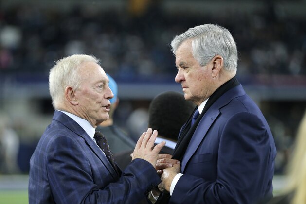 Dallas Cowboys team owner Jerry Jones, left, and Jerry Richardson, principal owner of the Carolina Panthers talk on the field before an NFL football game Thursday, Nov. 26, 2015, in Arlington, Texas. (AP Photo/Brandon Wade)