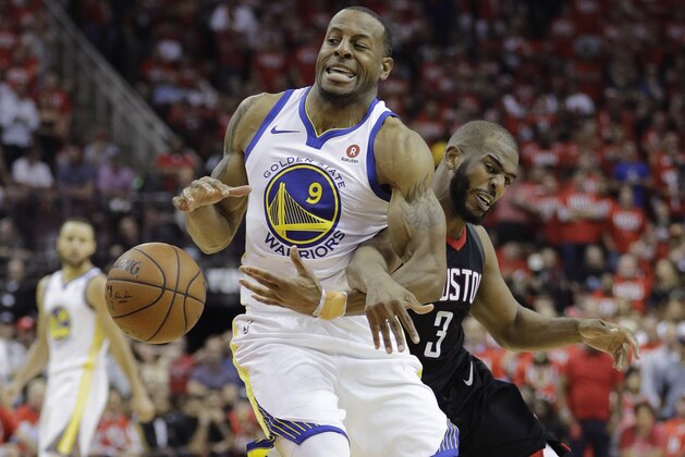 Golden State Warriors forward Andre Iguodala (9) is fouled by Houston Rockets guard Chris Paul (3) during the second half of Game 1 of the NBA basketball Western Conference Finals, Monday, May 14, 2018, in Houston. (AP Photo/David J. Phillip)