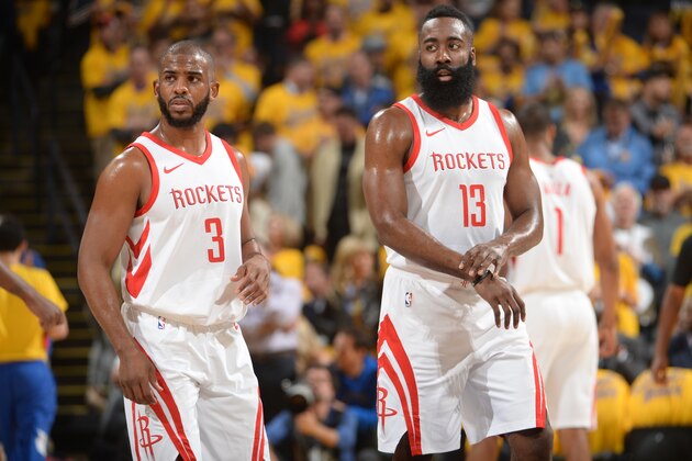 OAKLAND, CA - MAY 22:  Chris Paul #3 and James Harden #13 of the Houston Rockets during the game against the Golden State Warriors in Game Four of the Western Conference Finals of the 2018 NBA Playoffs on May 22, 2018 at ORACLE Arena in Oakland, California. NOTE TO USER: User expressly acknowledges and agrees that, by downloading and or using this photograph, user is consenting to the terms and conditions of Getty Images License Agreement. Mandatory Copyright Notice: Copyright 2018 NBAE (Photo by Noah Graham/NBAE via Getty Images)