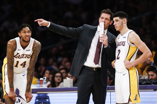 Los Angeles Lakers forward Brandon Ingram #14, looks on as head coach Luke Walton talks to guard Lonzo Ball #2 during the first half of an NBA basketball game Sunday, Nov. 19, 2017, in Los Angeles. (AP Photo/Ringo H.W. Chiu)