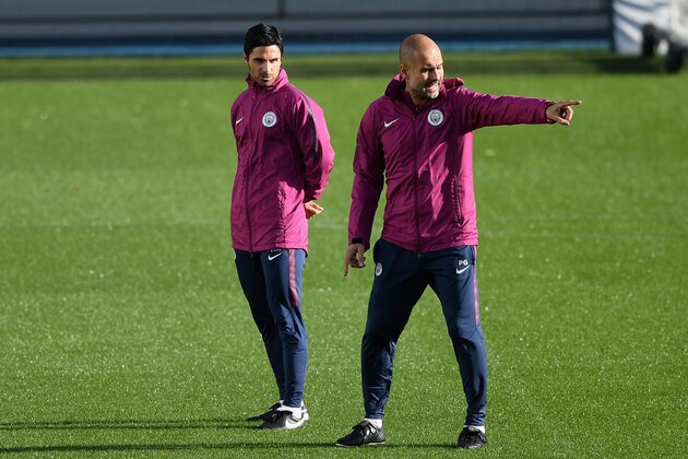 MANCHESTER, ENGLAND - OCTOBER 16: Josep Guardiola, Manager of Manchester City gives his team instructions as Mikel Arteta, Manchester City coach looks on during the Manchester City Training Session at the Etihad Stadium on October 16, 2017 in Manchester, England.  (Photo by Gareth Copley/Getty Images)