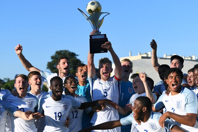 England's players celebrate with the trophy after winning the Under 21 international football final match England vs Ivory Coast, at the De Lattre Stadium in Aubagne, southern France on June 10, 2017, as part of the 45th Toulon Tournament ' Festival international Espoirs '.  / AFP PHOTO / ANNE-CHRISTINE POUJOULAT        (Photo credit should read ANNE-CHRISTINE POUJOULAT/AFP/Getty Images)