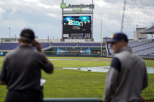 A tarp covers the pitcher's mound on a rainy day in Omaha, Neb., Tuesday, May 22, 2018, ahead of the Big Ten NCAA college baseball tournament. Minnesota is the top seed, Purdue is red hot, and defending champion Iowa is looking to get to the title game for the third straight year. The Big Ten Tournament looks to be wide open as it returns to TD Ameritrade Park for the third time since 2014. (AP Photo/Nati Harnik)