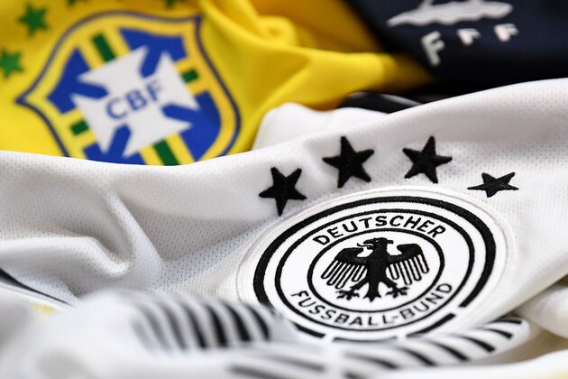 A picture taken on April 25, 2018 in Paris, shows the jersey of the Brasilian, German and French national football team for the FIFA 2018 World Cup football tournament. (Photo by FRANCK FIFE / AFP)        (Photo credit should read FRANCK FIFE/AFP/Getty Images)