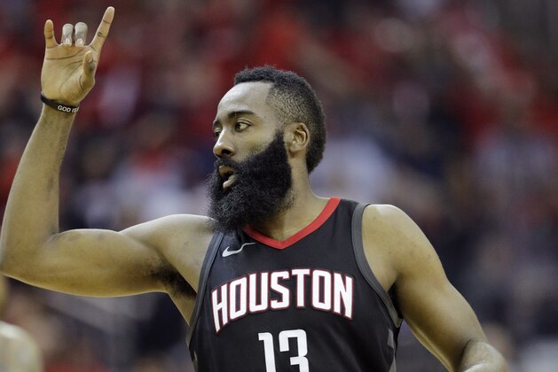 Houston Rockets guard James Harden (13) reacts to a score during the first half in Game 2 of the NBA basketball Western Conference Finals against the Golden State Warriors, Wednesday, May 16, 2018, in Houston. (AP Photo/David J. Phillip)