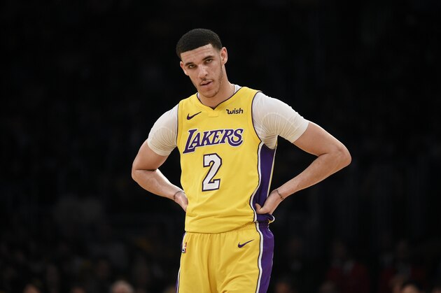 Los Angeles Lakers guard Lonzo Ball looks on during the first half of an NBA basketball game against the Denver Nuggets in Los Angeles, Tuesday, March 13, 2018. (AP Photo/Kelvin Kuo)