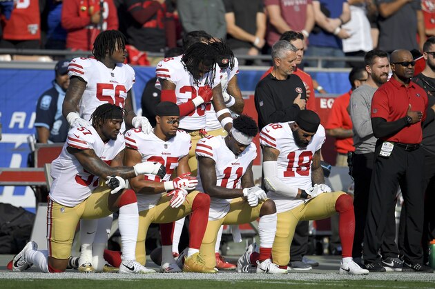 Members of the San Francisco 49ers kneel during the national anthem before an NFL football game against the Los Angeles Rams Sunday, Dec. 31, 2017, in Los Angeles. (AP Photo/Mark J. Terrill)