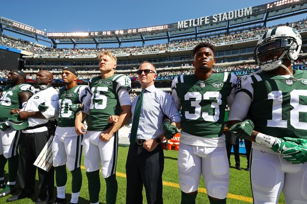 EAST RUTHERFORD, NJ - SEPTEMBER 24:  Jermaine Kearse #10 and Josh McCown #15, Jamal Adams #33 and Christopher Johnson CEO of the New York Jets stand in unison with their team during the National Anthem prior to an NFL game against the Miami Dolphins at MetLife Stadium on September 24, 2017 in East Rutherford, New Jersey.  (Photo by Al Bello/Getty Images)