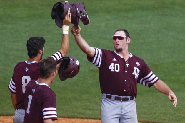 Texas A&M infielder Chris Andritsos (40) celebrates with Braden Shewmake (8) and Michael Helman (1) after hitting a three run homer during the seventh inning of a Southeastern Conference Tournament NCAA college baseball game against Georgia, Wednesday, May 23, 2018, in Hoover, Ala. (AP Photo/Butch Dill)