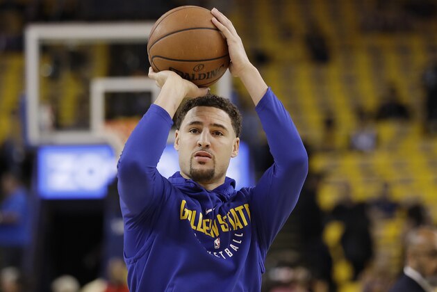 Golden State Warriors guard Klay Thompson warms up before Game 3 of the NBA basketball Western Conference Finals against the Houston Rockets in Oakland, Calif., Sunday, May 20, 2018. (AP Photo/Marcio Jose Sanchez)