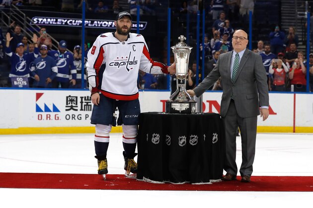 TAMPA, FL - MAY 23:  Alex Ovechkin #8 of the Washington Capitals and NHL Deputy Commissioner Bill Daly pose with the Prince of Wales Trophy after defeating the Tampa Bay Lightning in Game Seven of the Eastern Conference Finals during the 2018 NHL Stanley Cup Playoffs at Amalie Arena on May 23, 2018 in Tampa, Florida. The Washington Capitals defeated the Tampa Bay Lightning with a score of 4 to 0. (Photo by Mike Carlson/Getty Images)