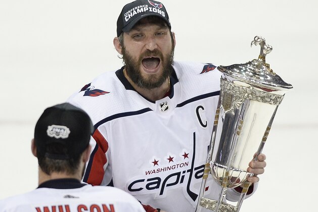 Washington Capitals right wing Tom Wilson (43) watches as left wing Alex Ovechkin celebrates while holding the Prince of Wales trophy after the Capitals defeated the Tampa Bay Lightning 4-0 in Game 7 of the NHL Eastern Conference finals hockey playoff series Wednesday, May 23, 2018, in Tampa, Fla. (AP Photo/Jason Behnken) Washington Capitals right wing Tom Wilson (43) watches as left wing Alex Ovechkin celebrates while holding the Prince of Wales trophy after the Capitals defeated the Tampa Bay Lightning 4-0 in Game 7 of the NHL Eastern Conference finals hockey playoff series Wednesday, May 23, 2018, in Tampa, Fla. (AP Photo/Jason Behnken)