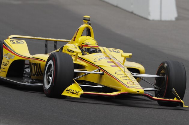 Helio Castroneves, of Brazil, heads into the first turn during a practice session for the IndyCar Indianapolis 500 auto race at Indianapolis Motor Speedway, in Indianapolis Monday, May 21, 2018. (AP Photo/Michael Conroy)