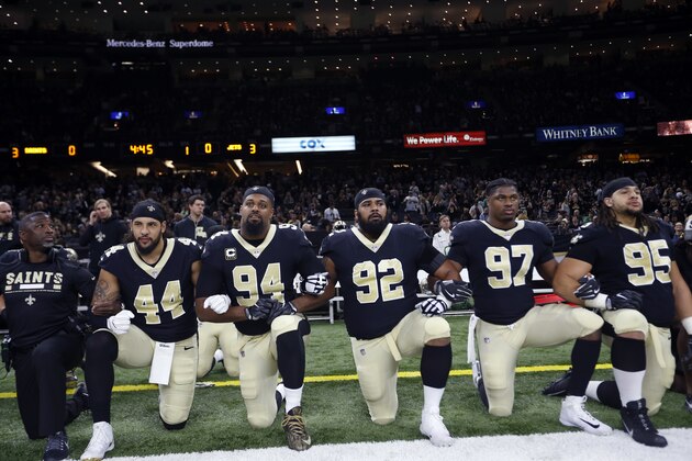 New Orleans Saints players kneel before the National Anthem before an NFL football game against the New York Jets in New Orleans, Sunday, Dec. 17, 2017. The players stood for the anthem. (AP Photo/Gerald Herbert)