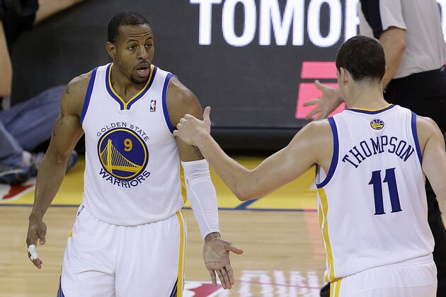 Golden State Warriors small forward Andre Iguodala (9) is congratulated by shooting guard Klay Thompson (11) after making a three point basket against the Los Angeles Clippers during the fourth quarter of Game 6 of an opening-round NBA basketball playoff series in Oakland, Calif., Thursday, May 1, 2014. The Warriors won 100-99. (AP Photo/Jeff Chiu)