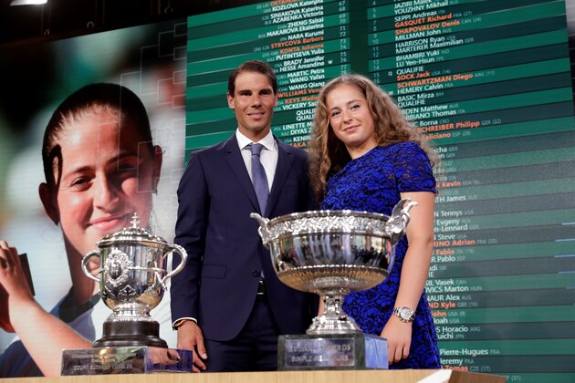 Spanish tennis player Rafael Nadal poses with Latvia's tennis player Jelena Ostapenko (R) after the official draw ceremony for the Roland Garros 2018 French Tennis Open in Paris on May 24, 2018. (Photo by Thomas SAMSON / AFP)        (Photo credit should read THOMAS SAMSON/AFP/Getty Images)