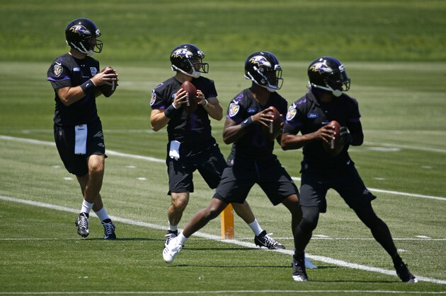Baltimore Ravens quarterbacks Joe Flacco, left, runs a drill alongside fellow quarterbacks Josh Woodrum, second from left, Lamar Jackson and Robert Griffin III during an NFL football organized team activity at the team's headquarters in Owings Mills, Md., Thursday, May 24, 2018. (AP Photo/Patrick Semansky)