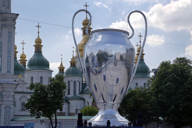 A huge replica of the Champions League trophy is placed in front of St. Sophia Cathedral, in Kiev, Ukraine, Wednesday, May 23, 2018. Liverpool will play Real Madrid in the Champions League Final on May 26 at the Olympiyski stadium in Kiev. (AP Photo/Efrem Lukatsky)