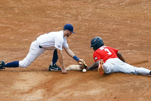 Georgia's Ivan Johnson (3) slides safely into second base as Mississippi infielder Jacob Adams (1) drops the ball on the tag during the eighth inning of a Southeastern Conference Tournament NCAA college baseball game, Thursday, May 24, 2018, in Hoover, Ala. (AP Photo/Butch Dill)