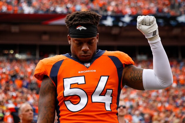 DENVER, CO - OCTOBER 1:  Inside linebacker Brandon Marshall #54 of the Denver Broncos stands and holds a fist in the air during the national anthem before a game against the Oakland Raiders at Sports Authority Field at Mile High on October 1, 2017 in Denver, Colorado. (Photo by Justin Edmonds/Getty Images)
