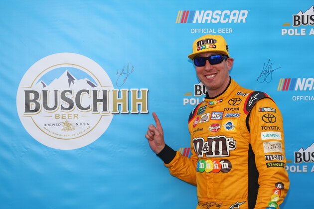 CHARLOTTE, NC - MAY 24:  Kyle Busch, driver of the #18 M&M's Red White & Blue Toyota, poses with the Busch Pole Award afer qualifying on the pole for the Monster Energy NASCAR Cup Series Coca-Cola 600 at Charlotte Motor Speedway on May 24, 2018 in Charlotte, North Carolina.  (Photo by Sarah Crabill/Getty Images)
